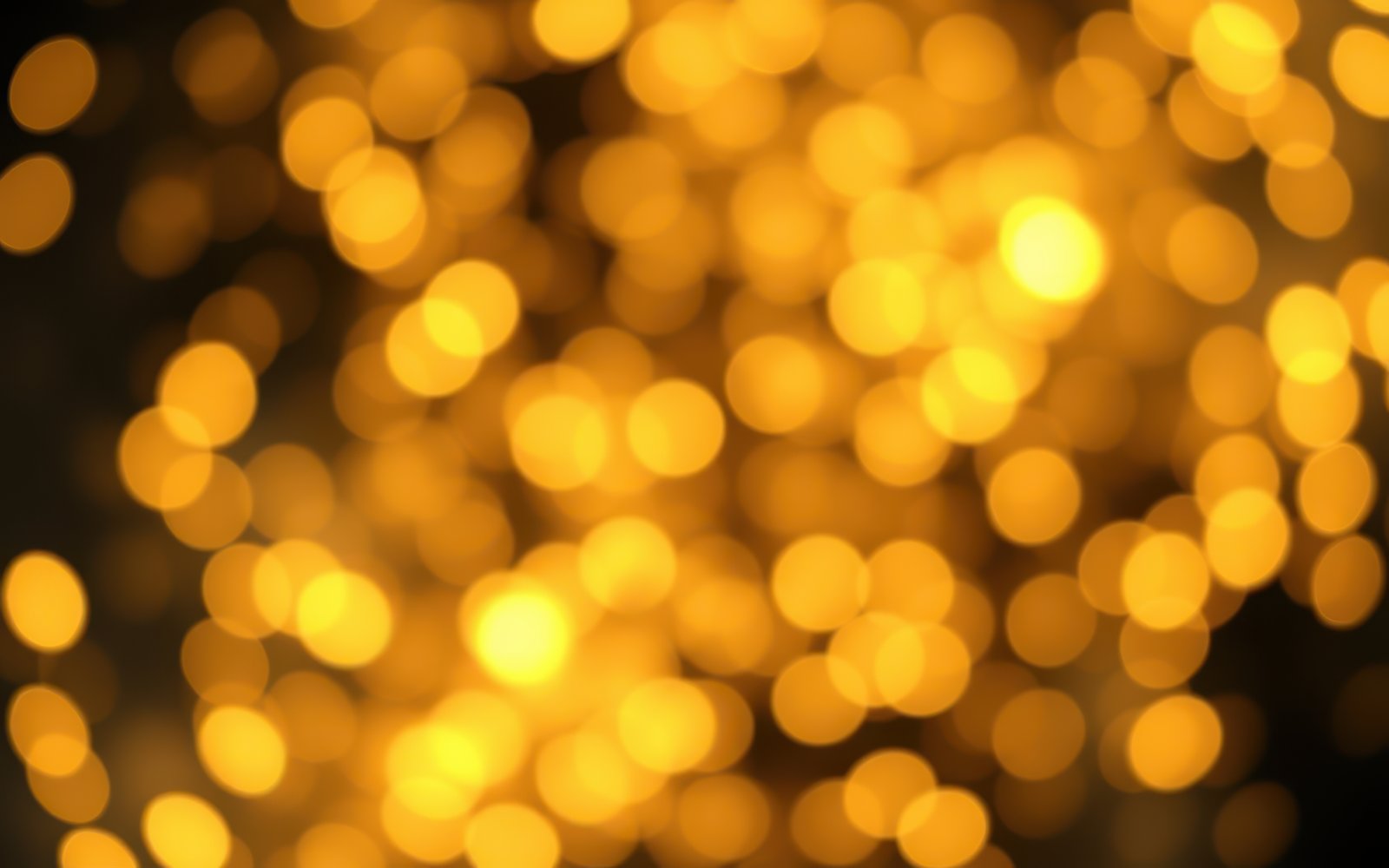Soft golden bokeh lights create a warm and inviting atmosphere for evening celebrations or gatherings
